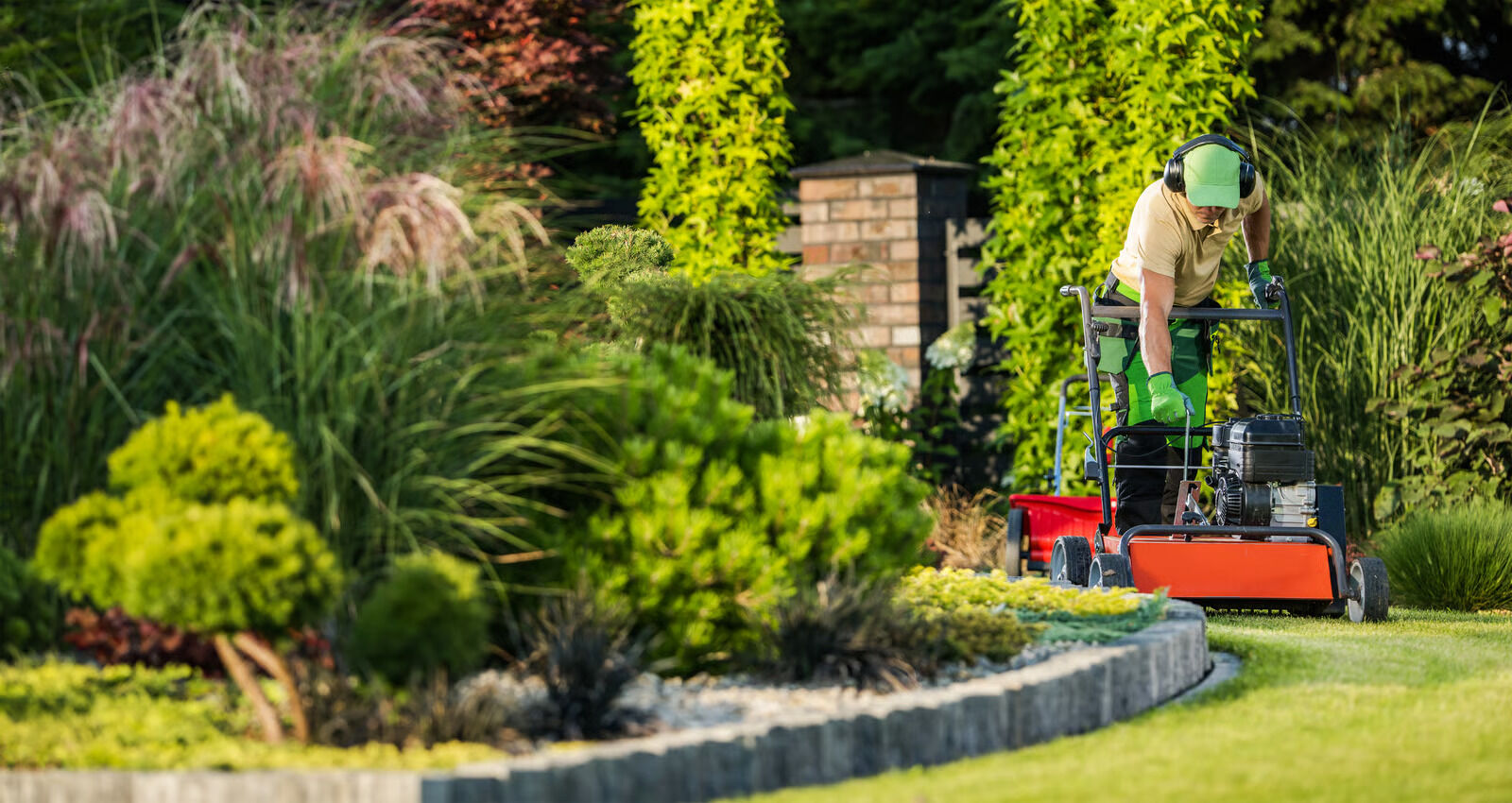 Lawn care and mowing in a Thani Landscaping garden